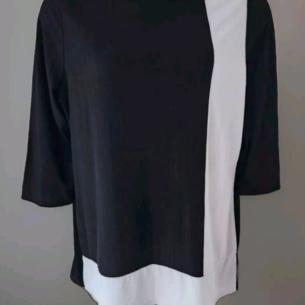 Chico’s easy wear blouse. Size XL. Black and white with tags